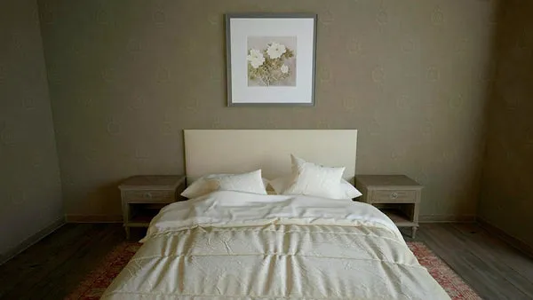 A neatly made bed in a calm, uncluttered bedroom.