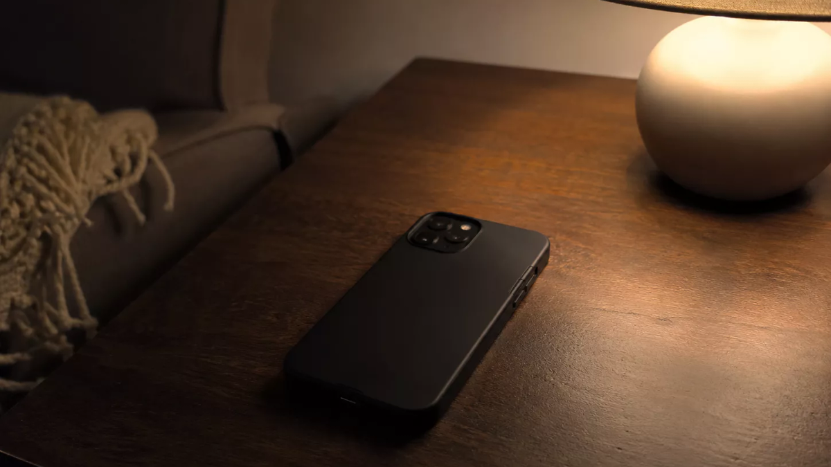 A person holding a smartphone, representing digital distraction.