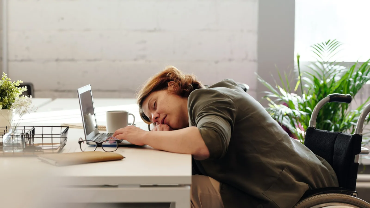 A person resting in a chair during the day.